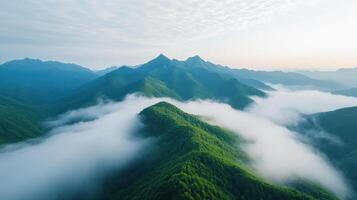 Breathtaking mountain landscape with lush greenery and misty valleys creates serene atmosphere photo