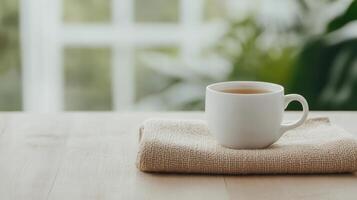 cozy cup of tea rests on soft cloth, inviting relaxation and warmth photo