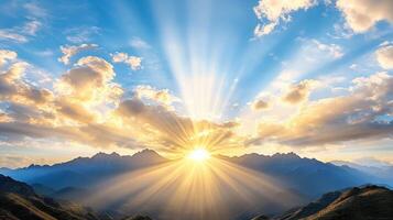 Sunrise over mountains with clouds and sun photo