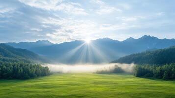 A beautiful sunrise over a green field with mountains in the background photo
