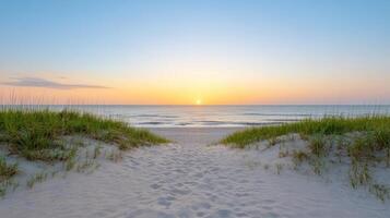 Tranquil beach scene sunrise, where soft orange meets fading blue hues, creating serene photo