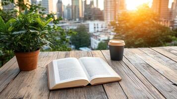 An open book and coffee on a wooden table with cityscape background photo