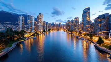 The city of vancouver is seen from a river photo