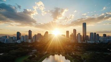The sun rises over a city skyline with a lake in the foreground photo