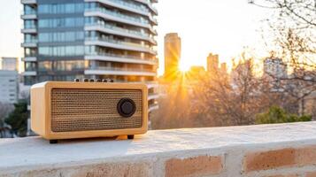 A wooden radio sitting on a ledge overlooking the city photo