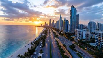 The sun sets over the ocean and city skyline in dubai photo