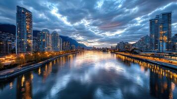 A river in the city at dusk with tall buildings photo