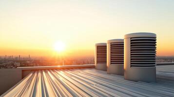 Air conditioning units on a roof at sunset photo