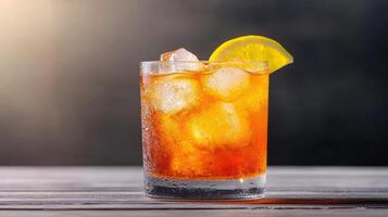A glass of iced tea with lemon wedge photo