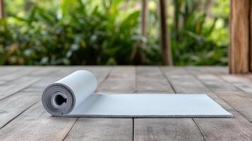 A yoga mat on a wooden floor photo