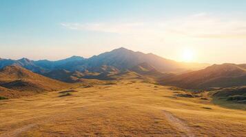 A view of a mountain range with a road leading to it photo