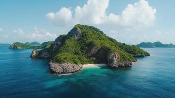 An island with green vegetation and blue water photo