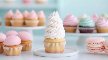 A table with cupcakes and macarons on it photo