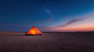 A tent in the desert at dusk photo