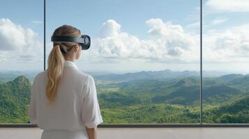 A woman wearing a virtual reality headset looking out a window photo