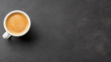 Top view of espresso coffee cup on black background photo