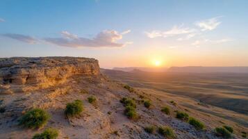 Sunset in the desert with mountains in the background photo