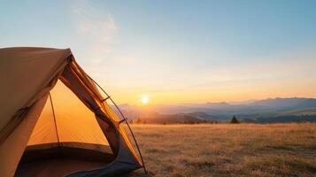 A tent is set up on a hillside photo