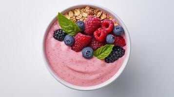 Berry smoothie bowl with fresh berries and granola on white background photo