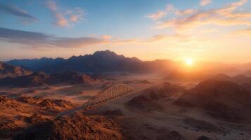 The bridge over the desert in the middle of the mountains photo