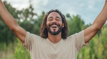 A man with long hair and beard is laughing photo