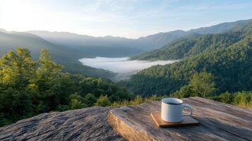 Coffee cup on a wooden table in the mountains photo
