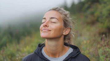 A woman is breathing deeply while looking up at the sky photo