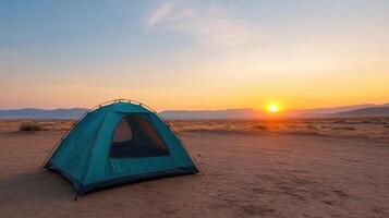 Camping in the desert at sunset photo
