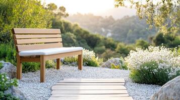 A wooden bench sitting on a path surrounded by trees photo