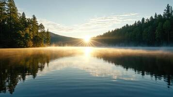 The sun rises over a lake in the forest photo