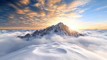 A mountain peak covered in snow and clouds photo