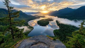 The sun rises over a river and mountains in the morning photo