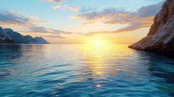 Sunset over the sea with rocks and water photo