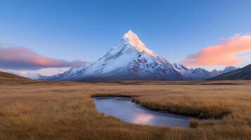 A mountain with a stream in front of it photo