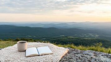Coffee and book on the mountain top photo