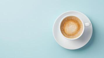 Top view of a cup of coffee on a blue background photo