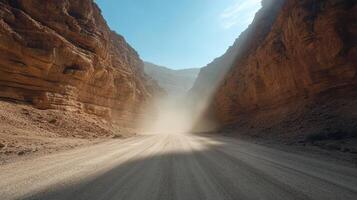 A dirt road in the middle of a canyon photo