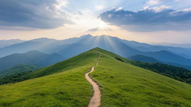 A path leading up a mountain with sun rays shining down photo