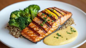 A plate with salmon, broccoli and quinoa photo