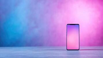 Samsung galaxy s10e smartphone on a table with a pink and blue background photo