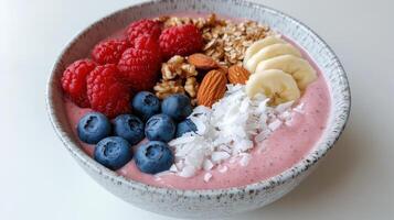 A bowl of fruit and nuts with berries and nuts photo