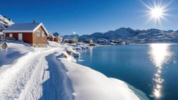 A red house sits on the shore of a lake photo
