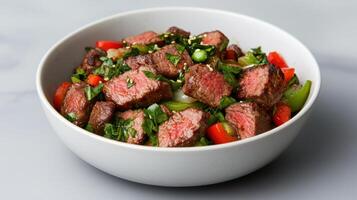 A bowl of beef and vegetables with a side of sesame seeds photo