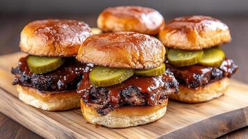 Three bbq sliders on a wooden board photo