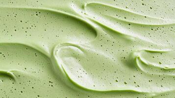 A close up of a green frosting with white swirls photo