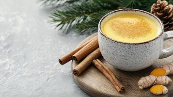 A cup of hot ginger tea with cinnamon and ginger photo