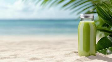 A green smoothie in a bottle on the beach photo