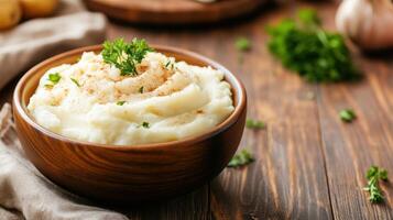Mashed potatoes in a bowl with parsley photo
