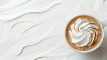 A cup of coffee with whipped cream on top photo