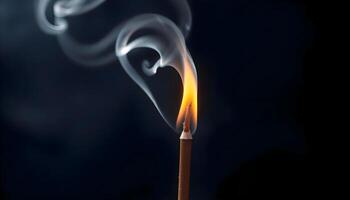 a matchstick with a lit match on it photo